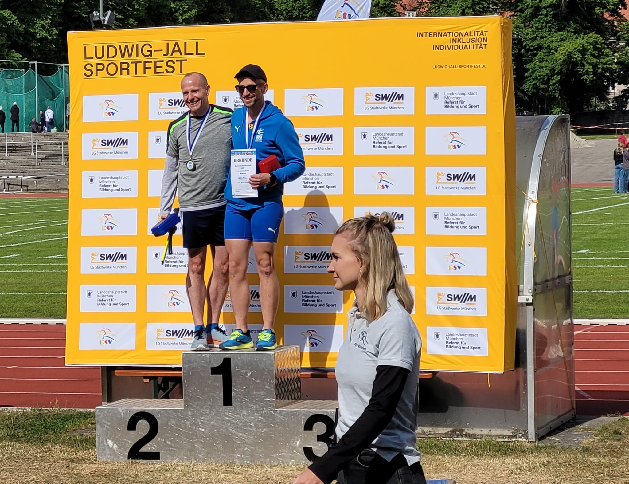 Stefan and Edi alone on the podium with their gold medals.