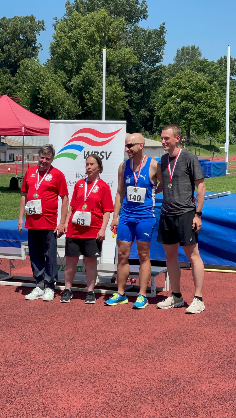 My Guide Simon and me getting a gold medal for the 400m, because we were the only men in my classification T12 for visually impaired.